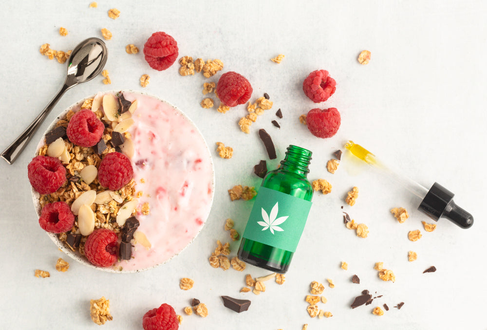 Glass Hemp Design Bottle Dropper Next To Fruit Bowl