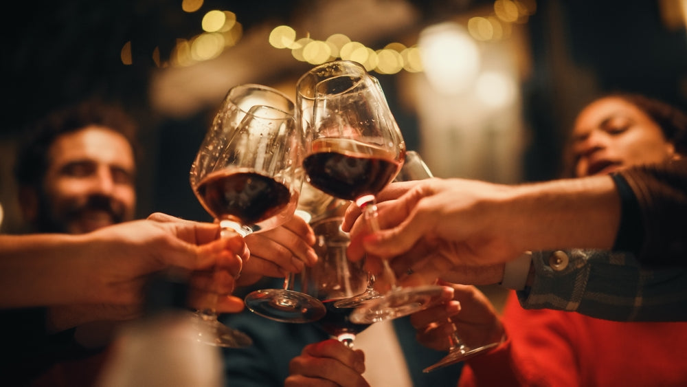 People Clicking Wine Glasses Together
