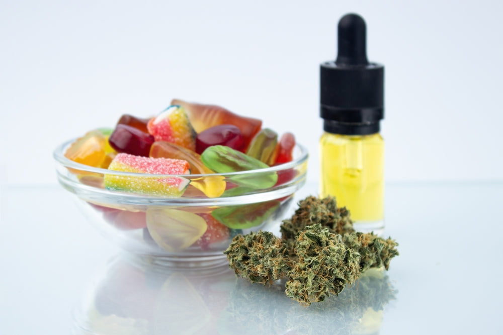 Glass Dropper Next To Fruit And Hemp